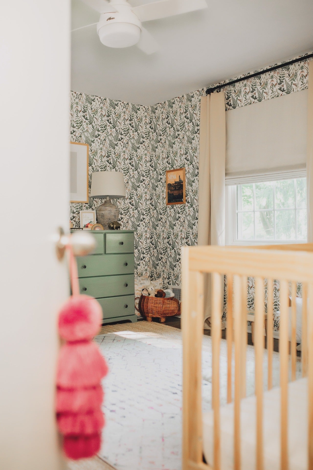 Toddler girl's nursery featuring Secret Garden wallpaper in White by Lisel Jane Ashlock for Hygge & West